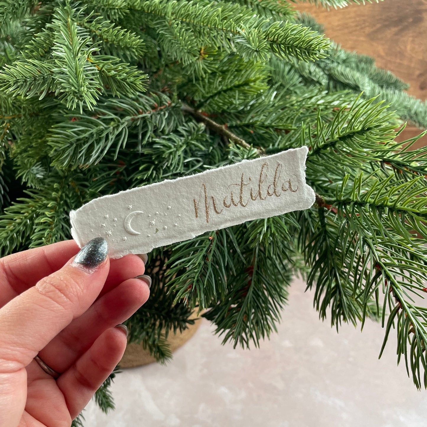 Christmas table place setting cards with celestial embossing detail