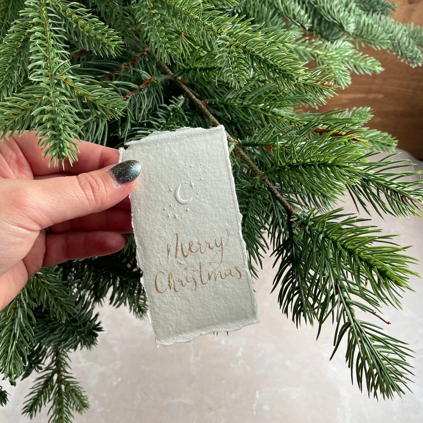 Christmas table place setting cards with celestial embossing detail