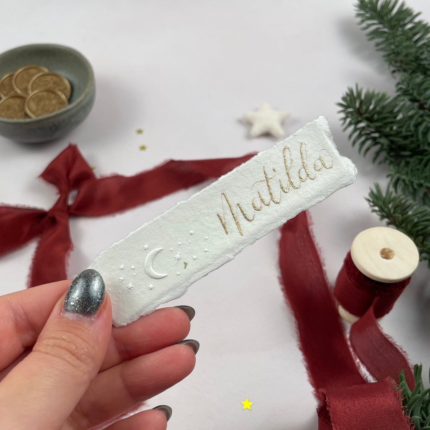 Christmas table place setting cards with celestial embossing detail