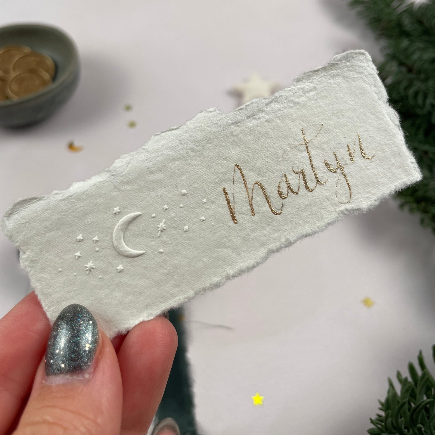 Christmas table place setting cards with celestial embossing detail