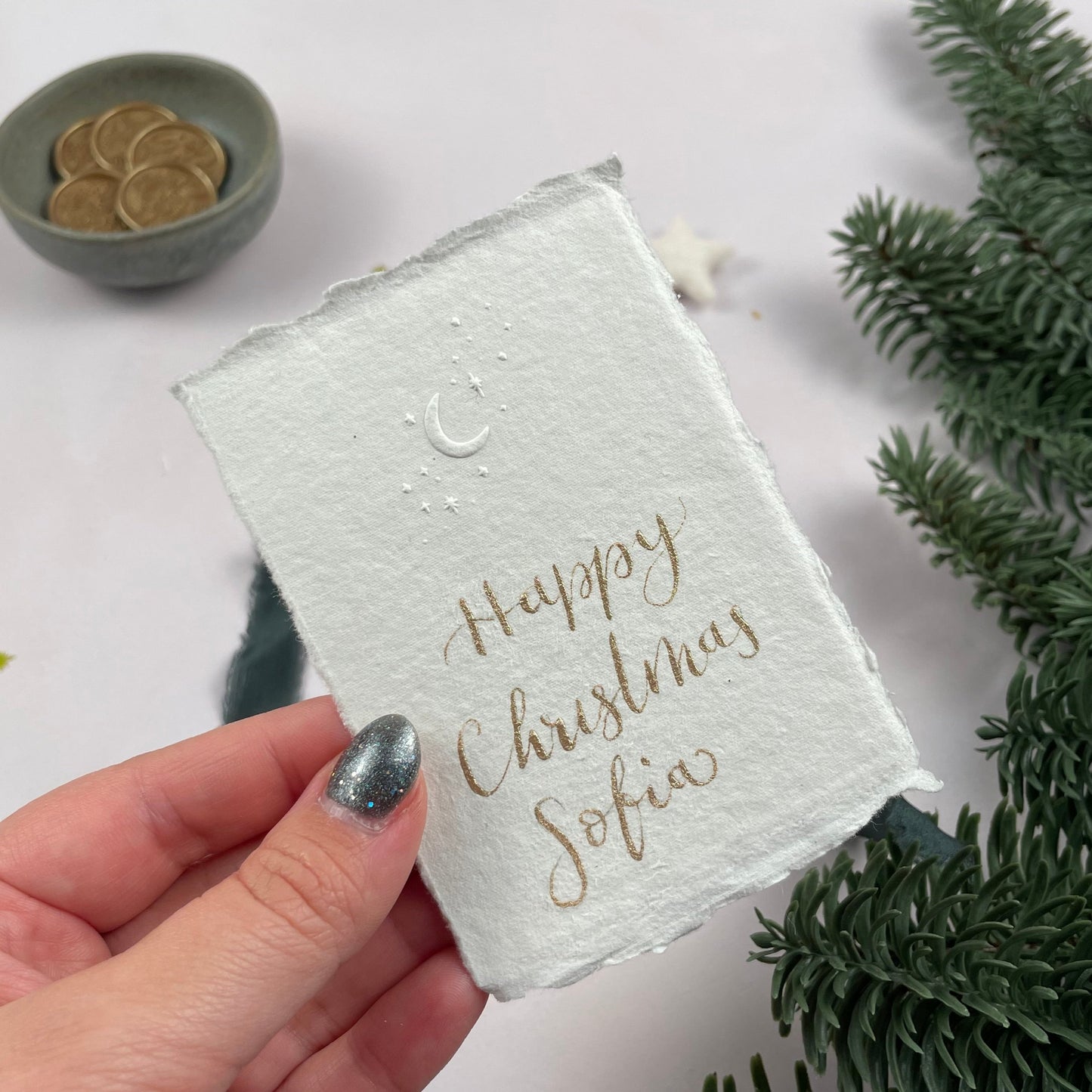 Christmas table place setting cards with celestial embossing detail