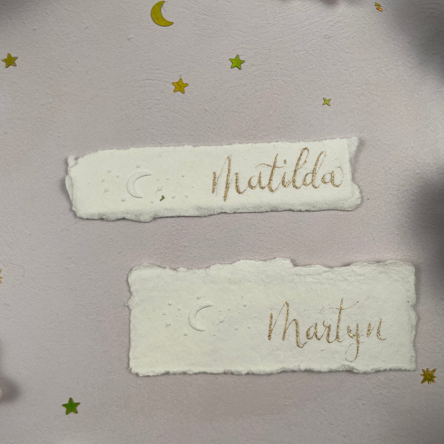 Christmas table place setting cards with celestial embossing detail
