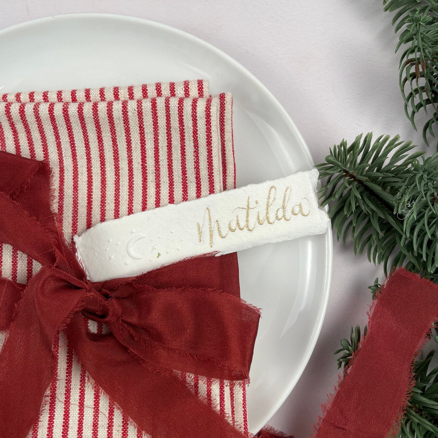 Christmas table place setting cards with celestial embossing detail
