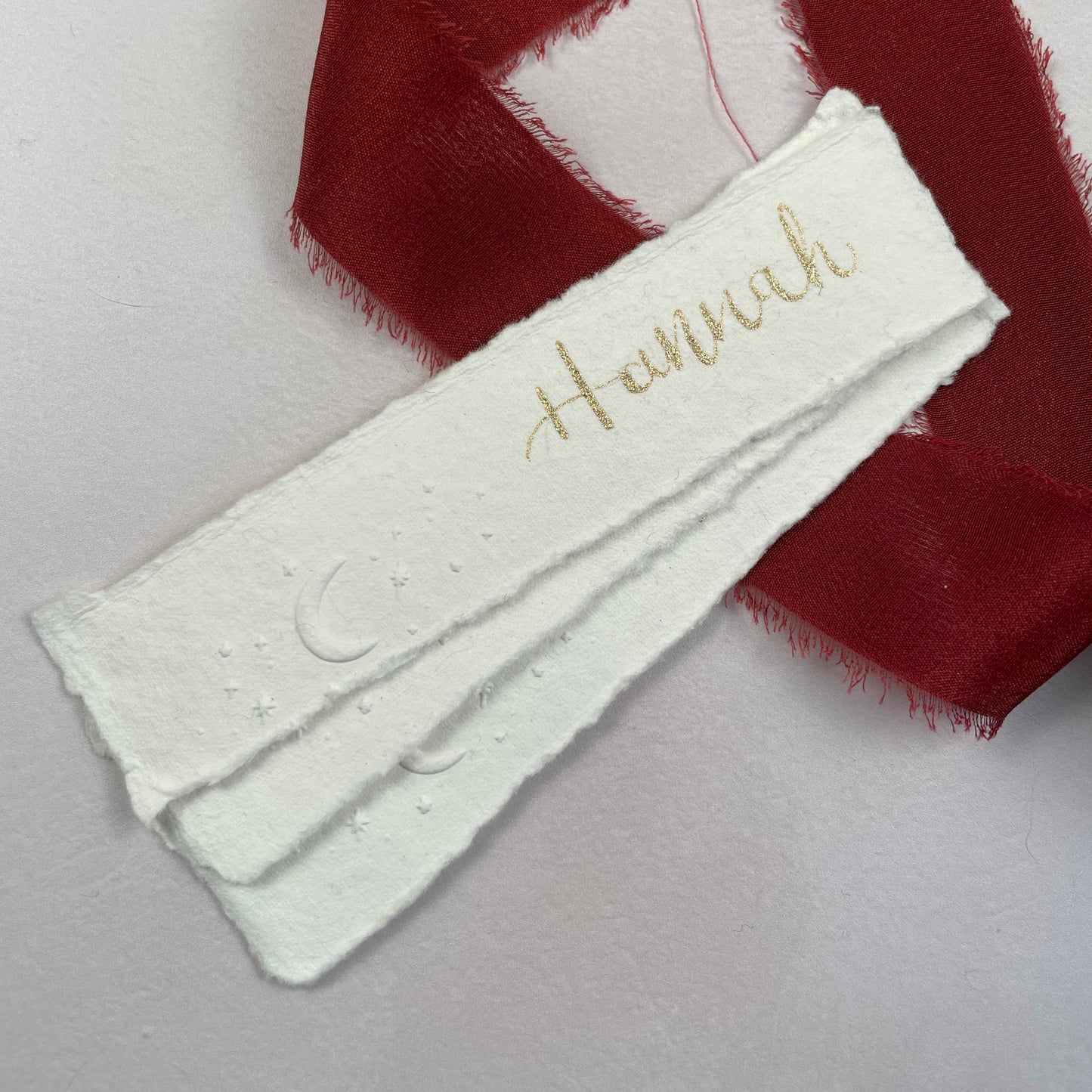 Christmas table place setting cards with celestial embossing detail